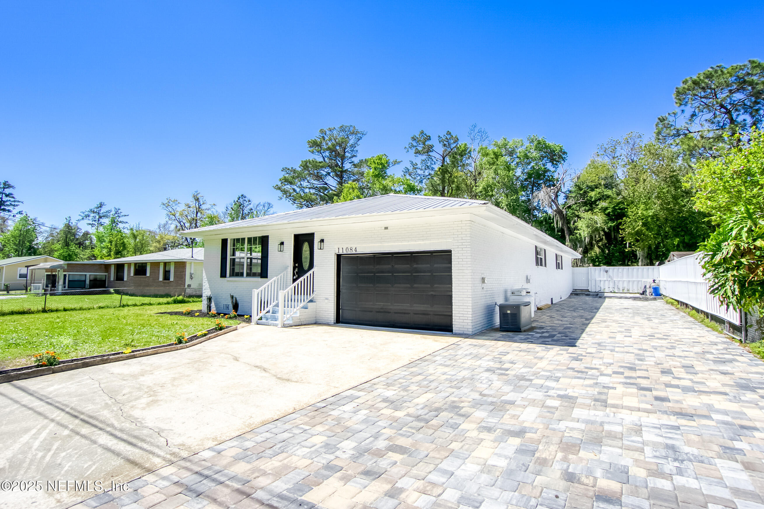 11084 Ker Del Road Jacksonville, FL 32218 - Photo 4 of 26 a view of a house with a yard and potted plants