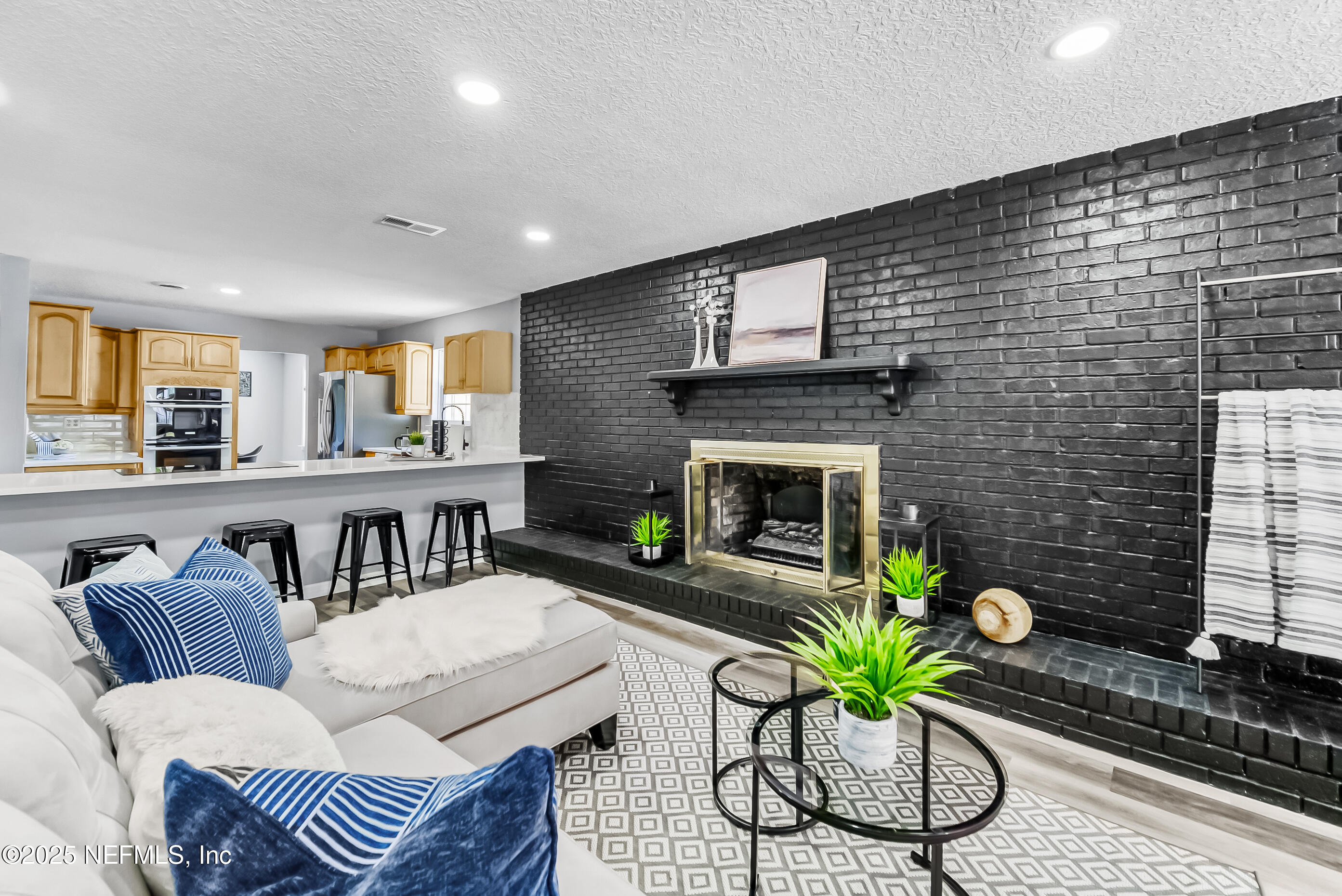 11084 Ker Del Road Jacksonville, FL 32218 - Photo 6 of 26 a living room with furniture and a fireplace