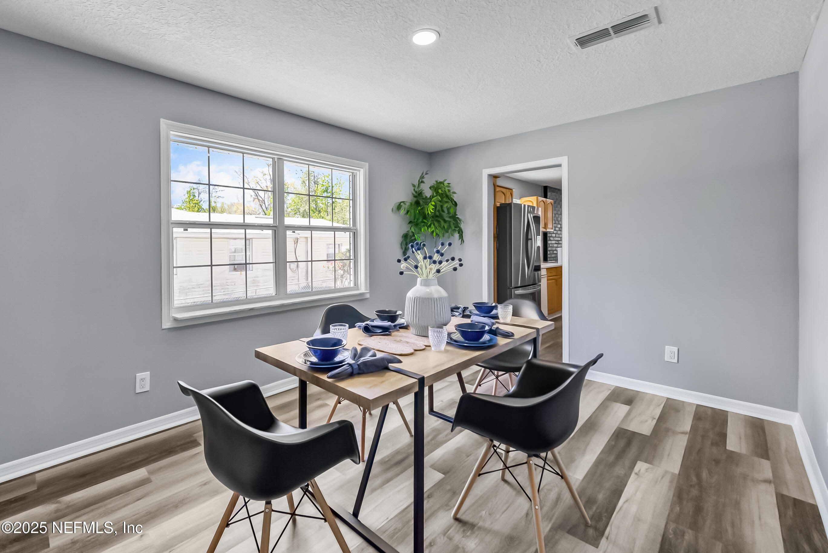 11084 Ker Del Road Jacksonville, FL 32218 - Photo 9 of 26 a living room with furniture and a window