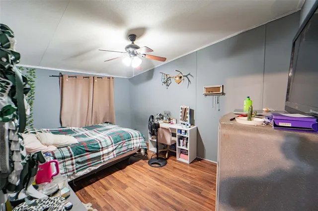 a bed room with a bed and a chandelier