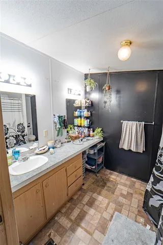 a spacious bathroom with a sink double vanity and a mirror