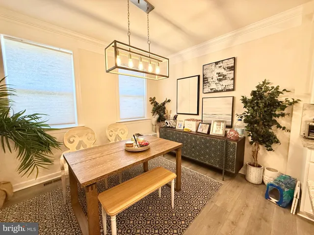 a balcony with furniture and a potted plant