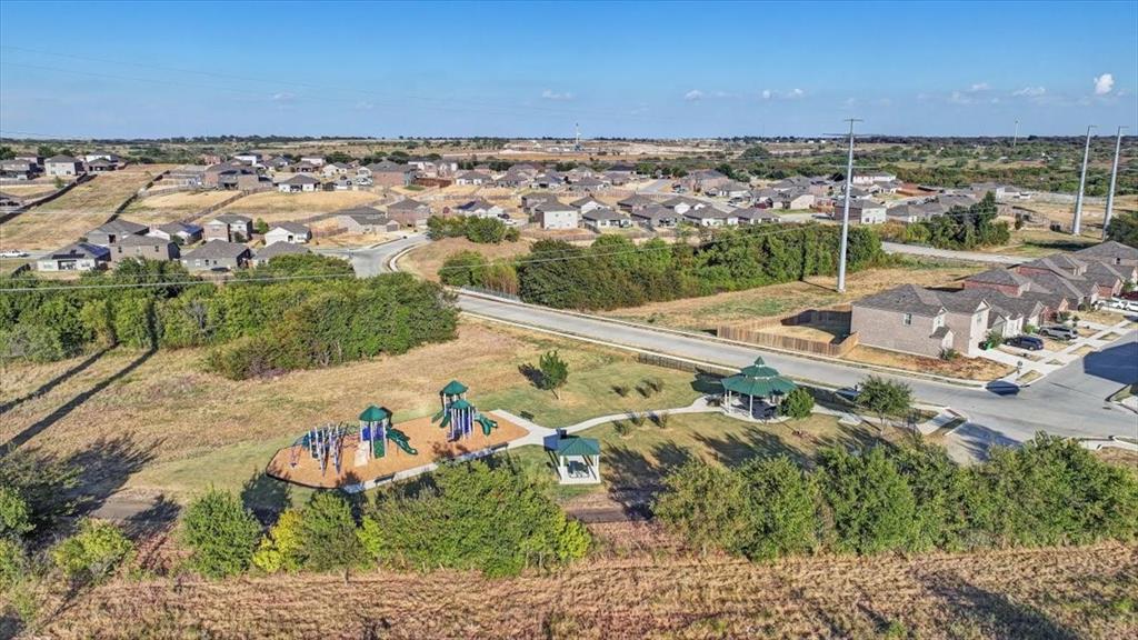 119 Barbwire Way Newark, TX 76071 - Photo 37 of 40 Club house with pools, basketball court, and playground