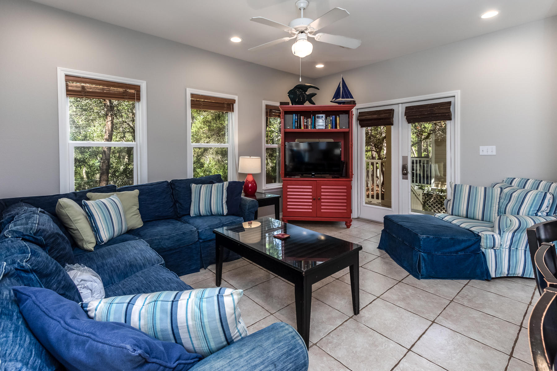 460 Hidden Lake Way Santa Rosa Beach, FL 32459 - Photo 18 of 40 a living room with furniture a chandelier and a window