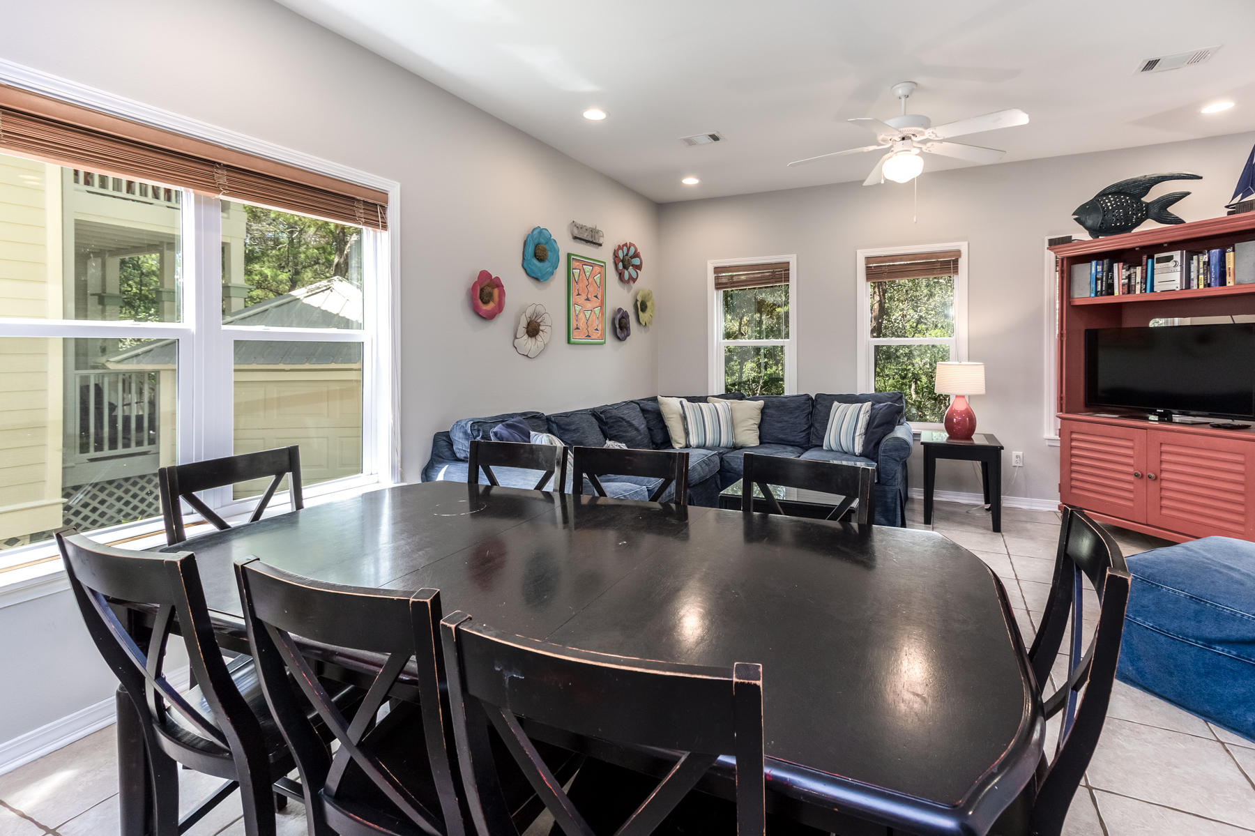 460 Hidden Lake Way Santa Rosa Beach, FL 32459 - Photo 19 of 40 a view of a dining room with furniture window and wooden floor