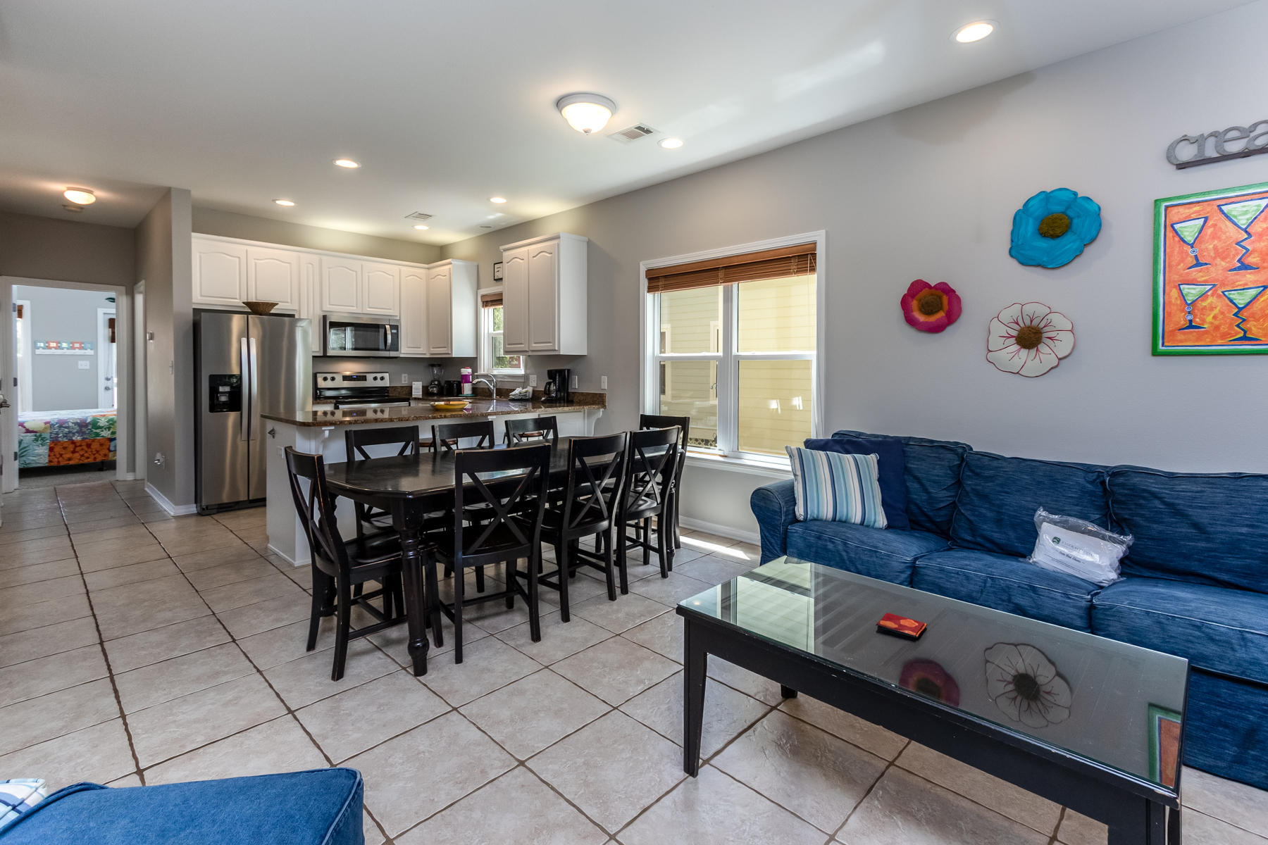 460 Hidden Lake Way Santa Rosa Beach, FL 32459 - Photo 23 of 40 a view of a dining room with furniture and wooden floor