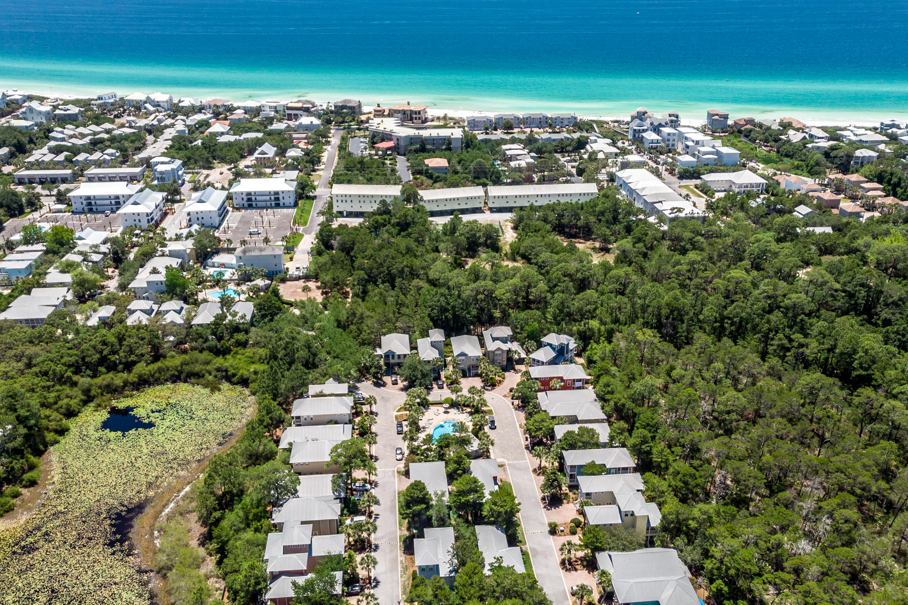 460 Hidden Lake Way Santa Rosa Beach, FL 32459 - Photo 32 of 40 an aerial view of residential houses with outdoor space and trees