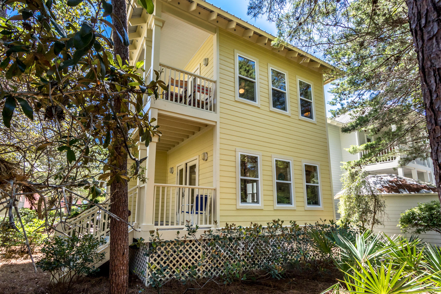 460 Hidden Lake Way Santa Rosa Beach, FL 32459 - Photo 5 of 40 a front view of a house with a tree