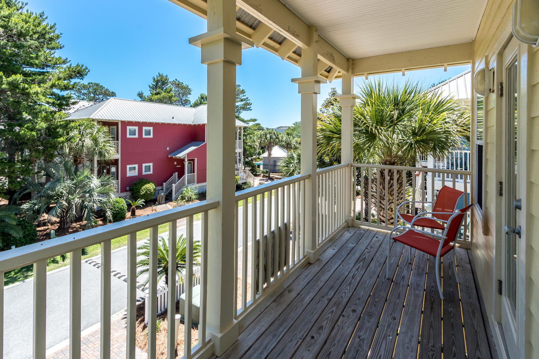 460 Hidden Lake Way Santa Rosa Beach, FL 32459 - Photo 9 of 40 a view of a balcony with wooden floor