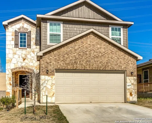 a view of house with garage