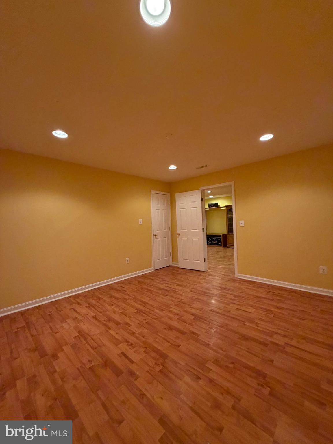 8650 Trenton Chapel Way Manassas, VA 20109 - Photo 4 of 8 a view of an empty room with wooden floor