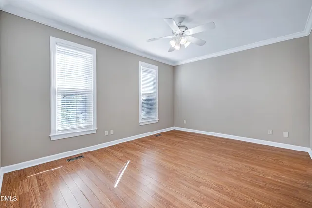 a view of an empty room with windows