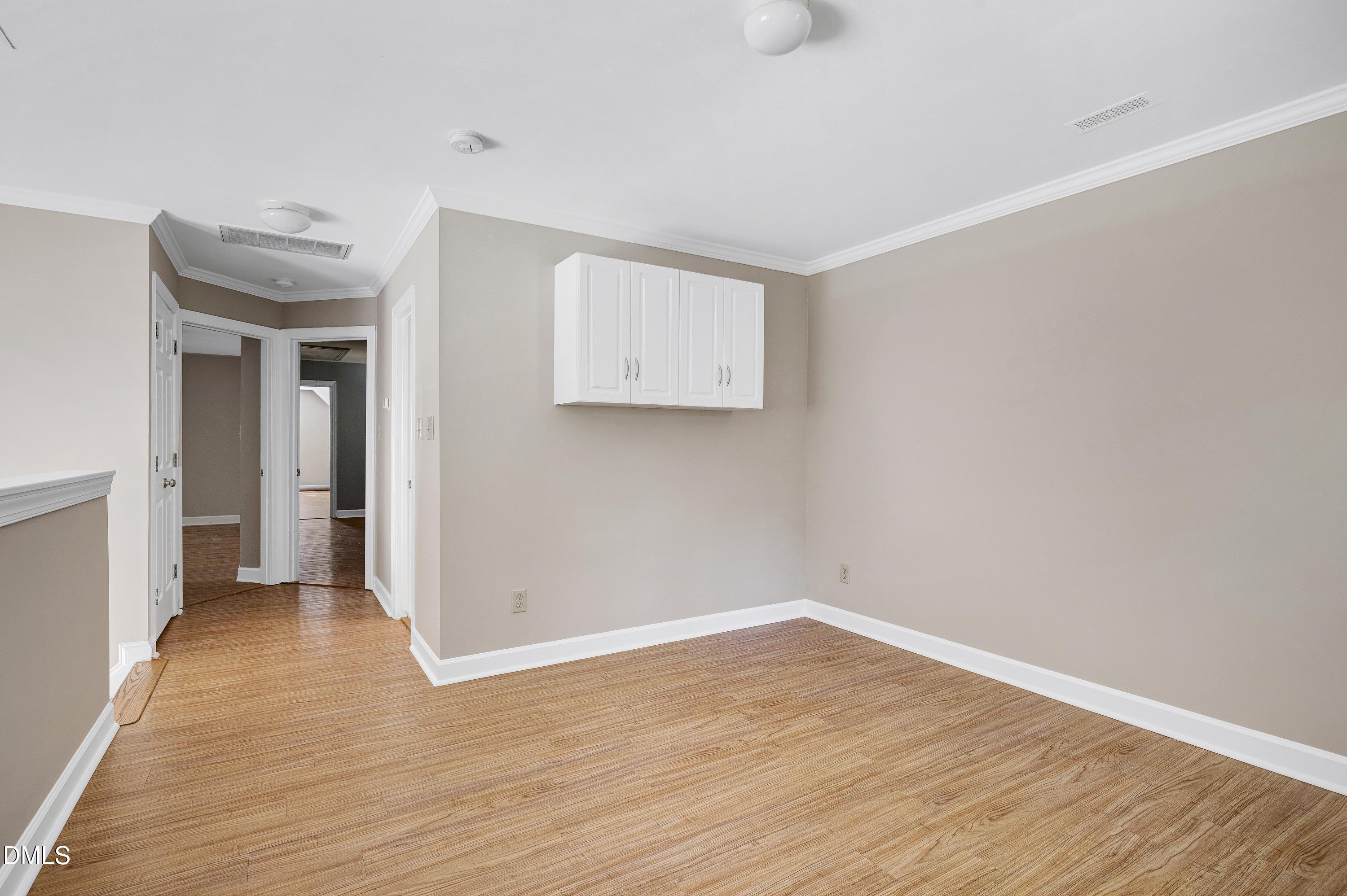 4804 Sinclair Drive Raleigh, NC 27616 - Photo 24 of 37 a view of an empty room with wooden floor