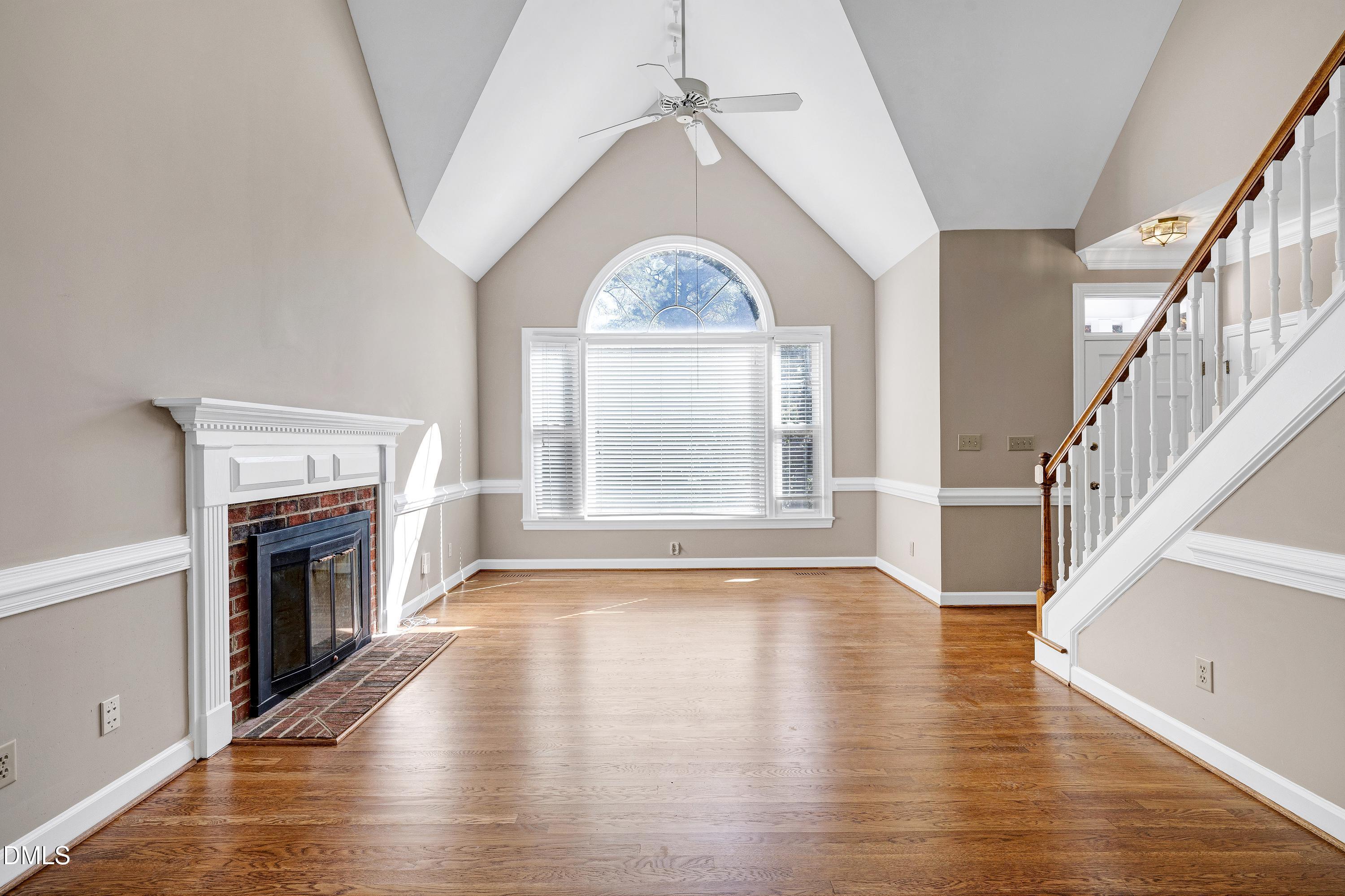 4804 Sinclair Drive Raleigh, NC 27616 - Photo 6 of 37 a view of an empty room window wooden floor and fire place