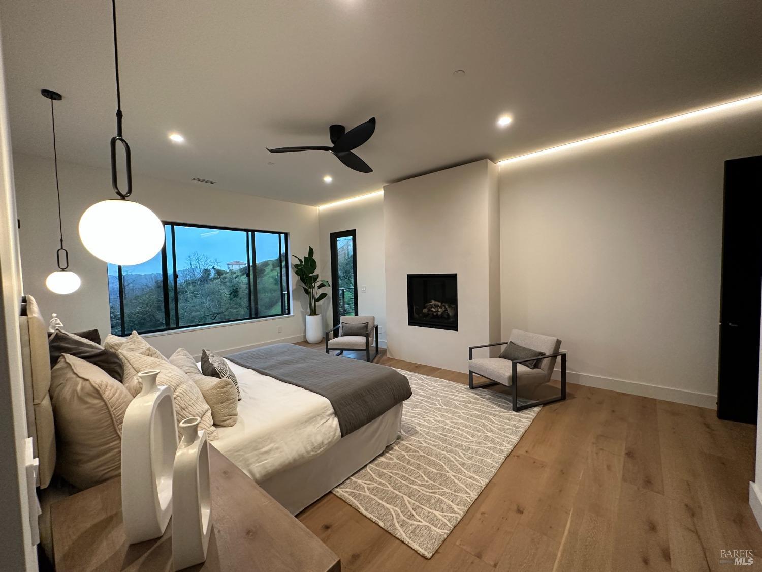 3921 Flintridge Drive Santa Rosa, CA 95403 - Photo 26 of 67 a bed room with a bed a couch and a large mirror