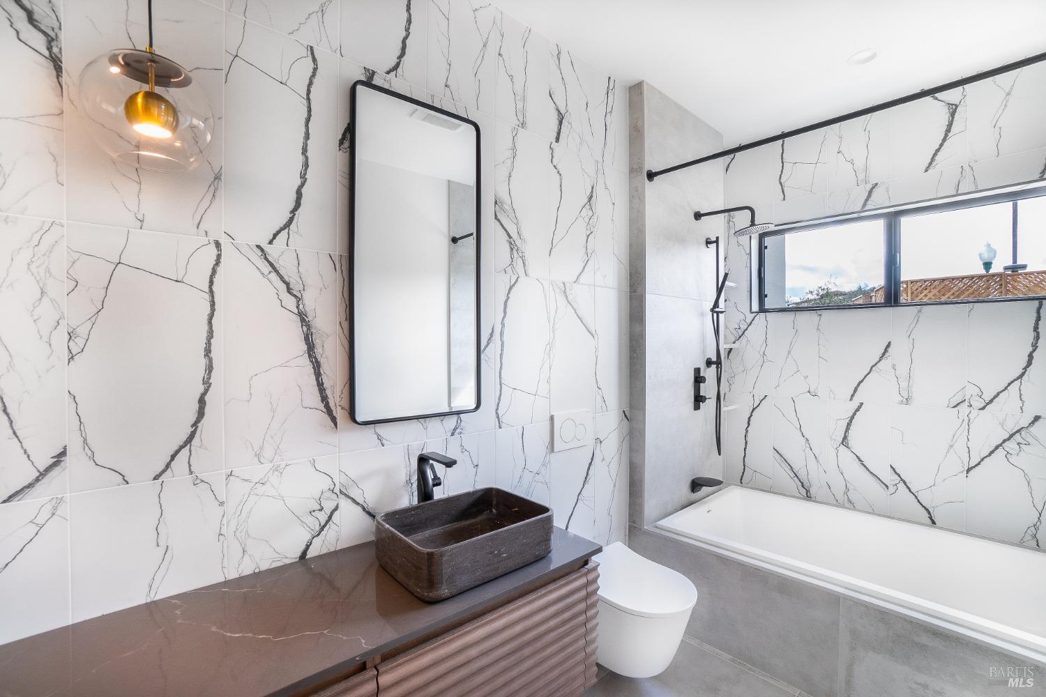 3921 Flintridge Drive Santa Rosa, CA 95403 - Photo 49 of 67 a bathroom with a toilet sink and shower curtain