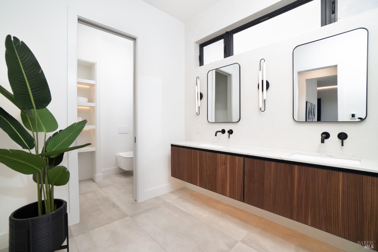 3921 Flintridge Drive Santa Rosa, CA 95403 - Photo 58 of 67 a bathroom with a double vanity sink and a mirror