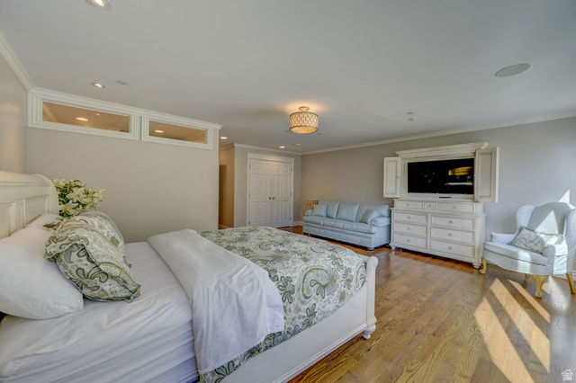 9699 Bypass Road, Unit 5 Alta, UT 84092 - Photo 36 of 54 Spacious room featuring hardwood flooring, recessed lighting, crown molding, and a built-in speaker system