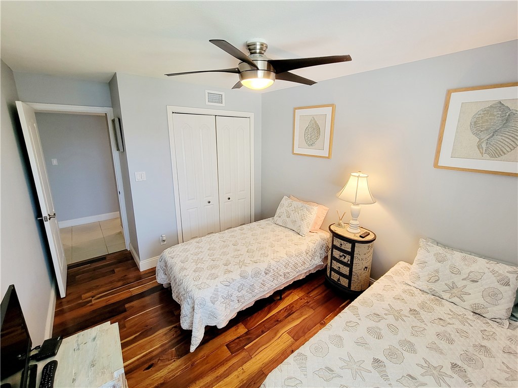 4450 Florida A1A, Unit 303 Vero Beach, FL 32963 - Photo 21 of 24 a bedroom with a bed and a dresser