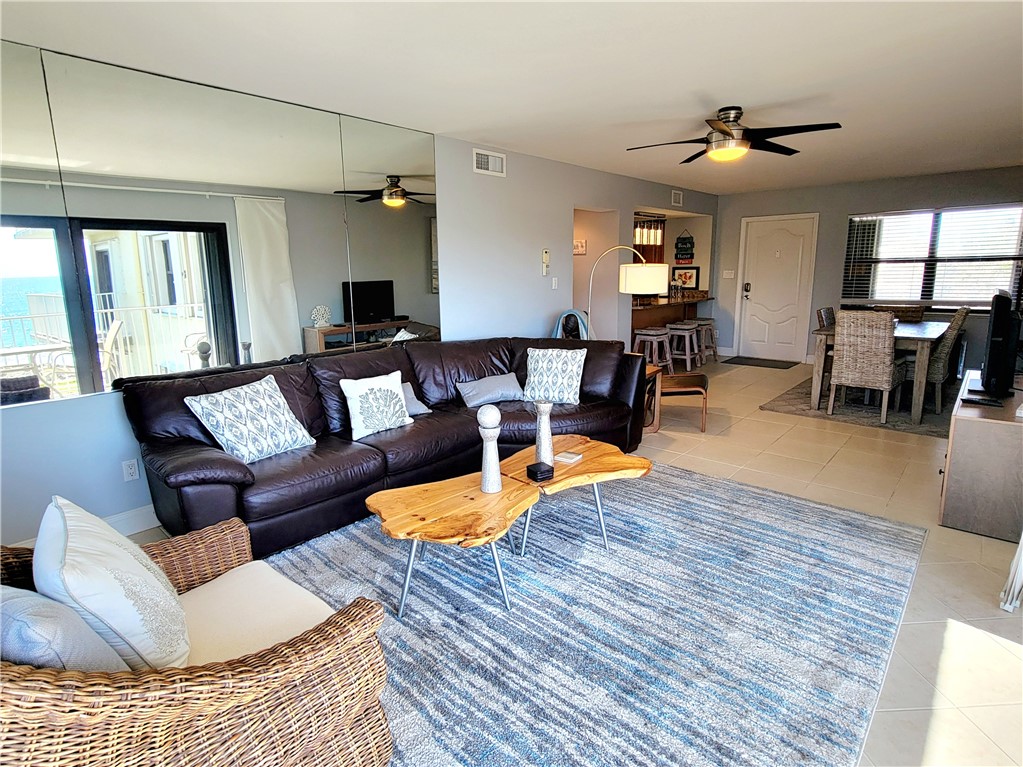 4450 Florida A1A, Unit 303 Vero Beach, FL 32963 - Photo 10 of 24 a living room with furniture and wooden floor