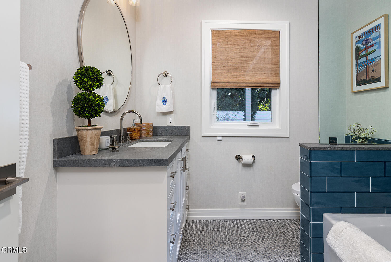 650 Westbridge Place Pasadena, CA 91105 - Photo 20 of 31 a bathroom with a toilet a sink and mirror
