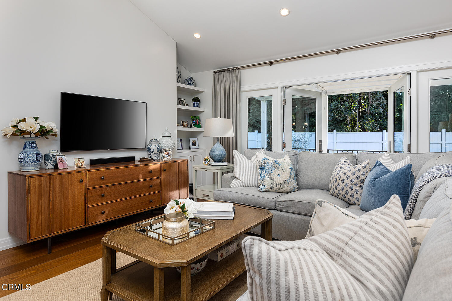 650 Westbridge Place Pasadena, CA 91105 - Photo 6 of 31 a living room with furniture and a flat screen tv