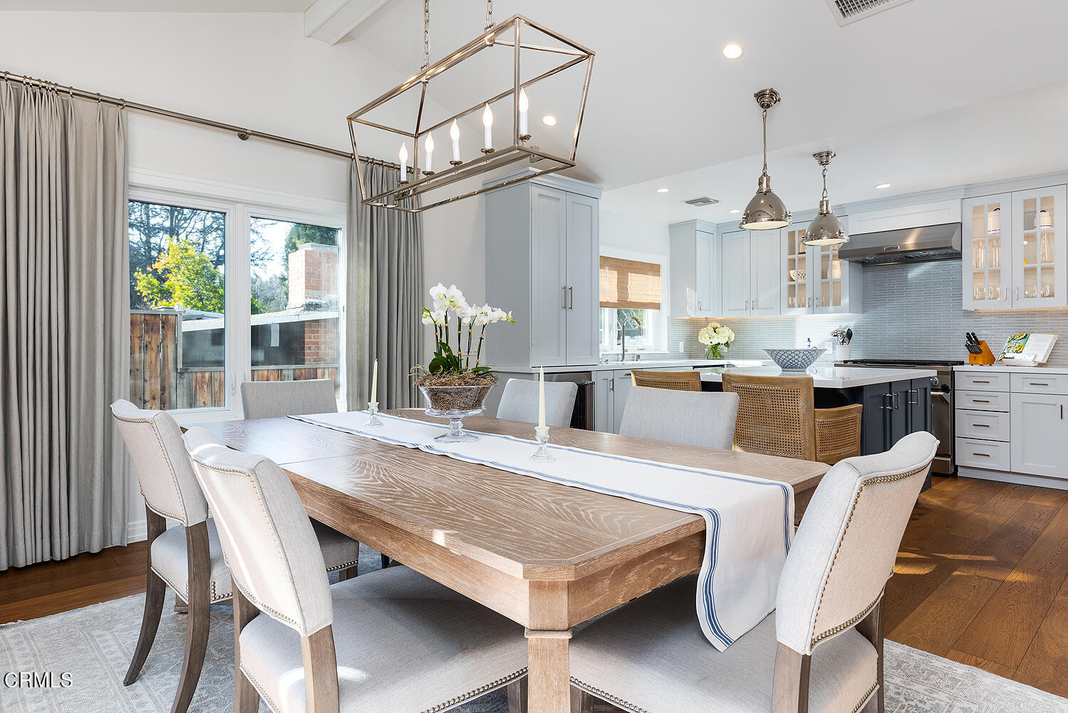 650 Westbridge Place Pasadena, CA 91105 - Photo 9 of 31 a view of a dining room and livingroom with furniture wooden floor a chandelier