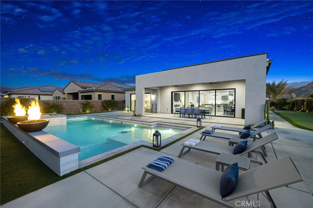 80380 Old Rnch Trail North La Quinta, CA 92253 - Photo 1 of 35 a view of a house with swimming pool and sitting area