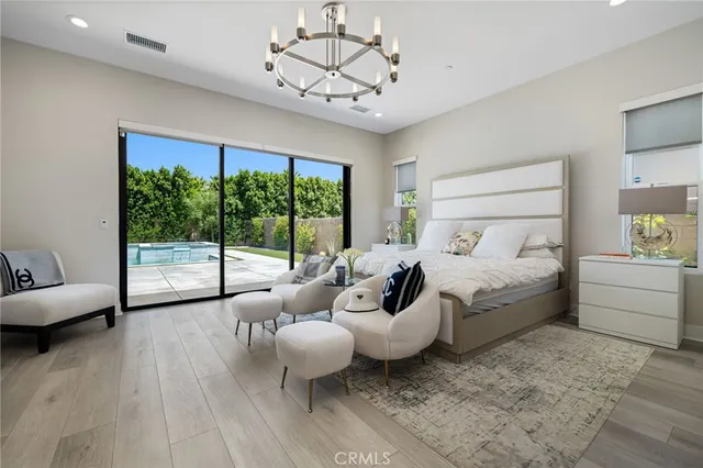 a bed room with a bed and a large window