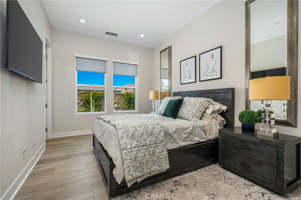 80380 Old Rnch Trail North La Quinta, CA 92253 - Photo 16 of 35 a bed sitting in a bedroom next to a window