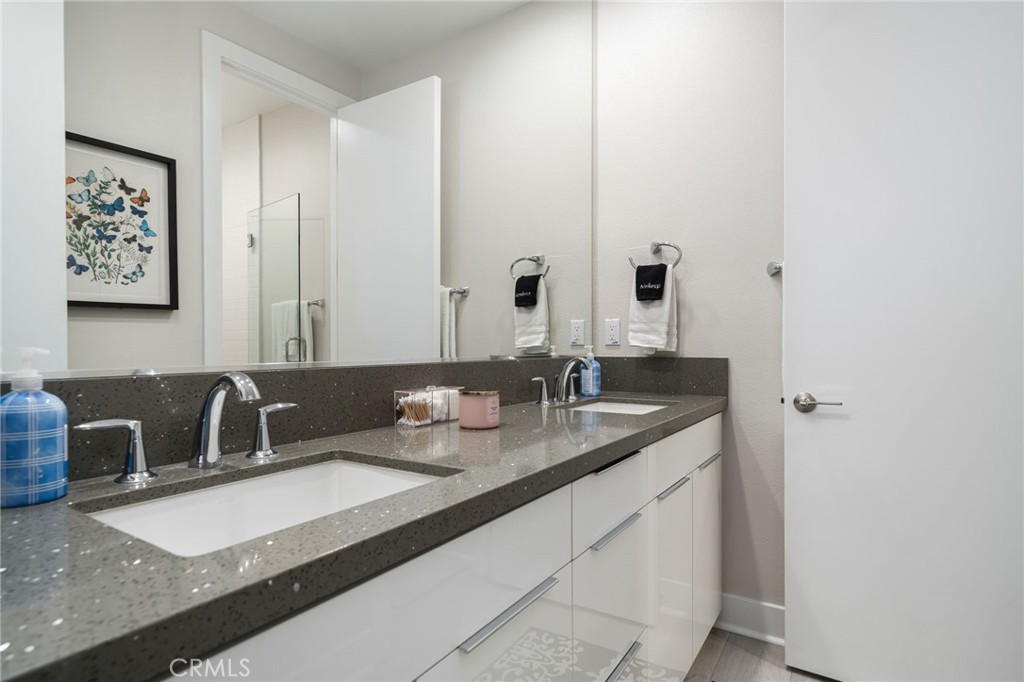 80380 Old Rnch Trail North La Quinta, CA 92253 - Photo 17 of 35 a bathroom with a granite countertop sink and a mirror