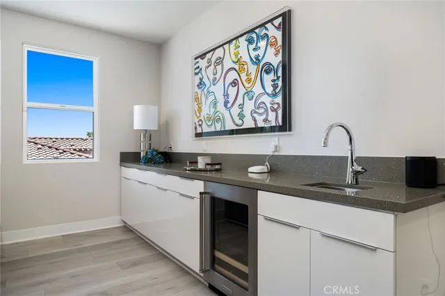 a kitchen with stainless steel appliances granite countertop a sink and a microwave