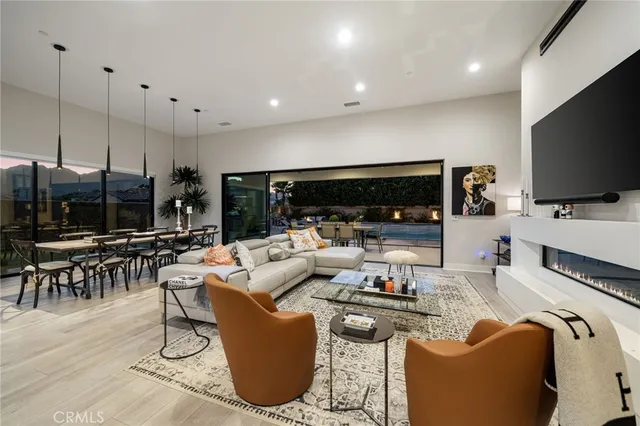 a living room with fireplace furniture and a flat screen tv