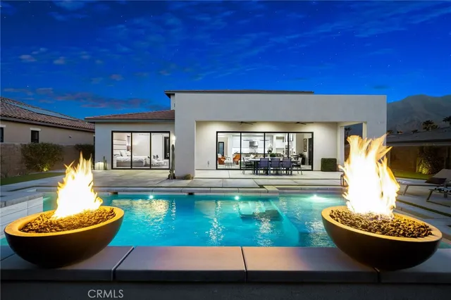 a view of a swimming pool with back yard