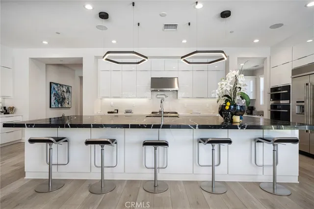 a kitchen with counter top space and windows
