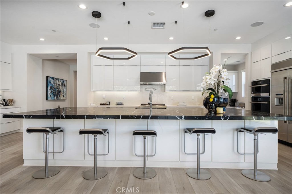 80380 Old Rnch Trail North La Quinta, CA 92253 - Photo 9 of 35 a kitchen with counter top space and windows