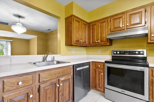 a kitchen with a stove microwave and sink