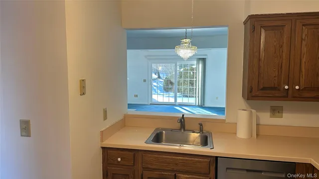 a kitchen with a sink and a window