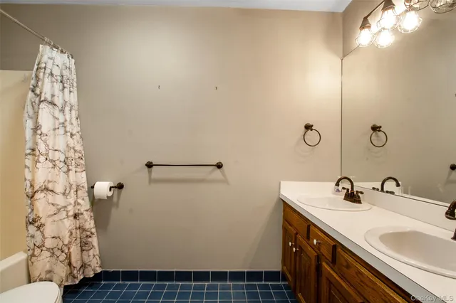 a bathroom with a sink and mirror