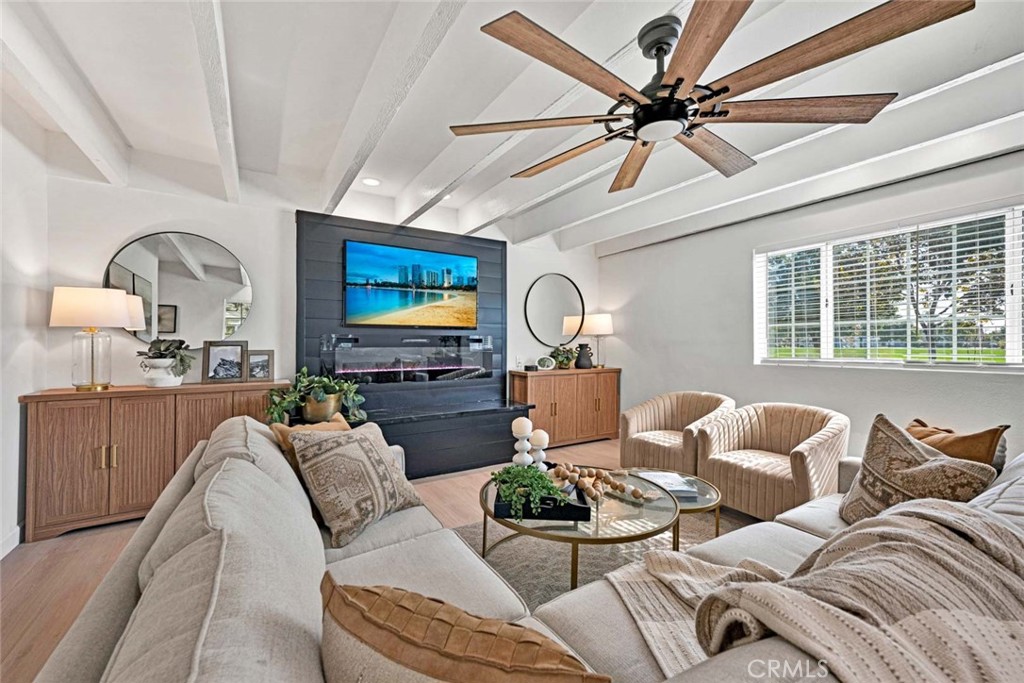 5331 Cerulean Avenue Garden Grove, CA 92845 - Photo 14 of 44 a living room with furniture a large window and a flat screen tv