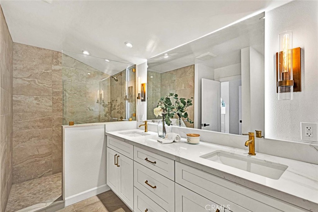 5331 Cerulean Avenue Garden Grove, CA 92845 - Photo 20 of 44 a bathroom with double vanity sink and a mirror