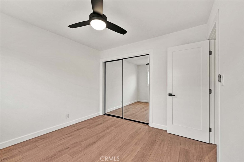 5331 Cerulean Avenue Garden Grove, CA 92845 - Photo 26 of 44 a view of an empty room with wooden floor