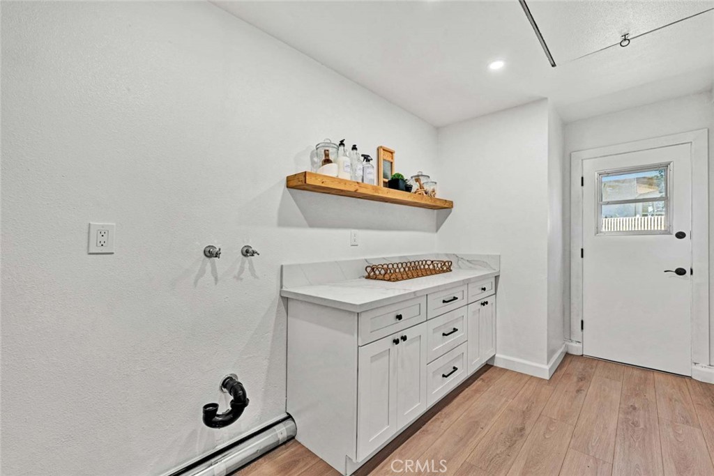 5331 Cerulean Avenue Garden Grove, CA 92845 - Photo 31 of 44 a room with cabinets and wooden floor