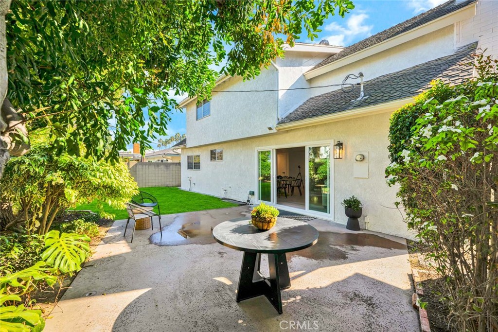 5331 Cerulean Avenue Garden Grove, CA 92845 - Photo 34 of 44 a view of a backyard with table and chairs and potted plants