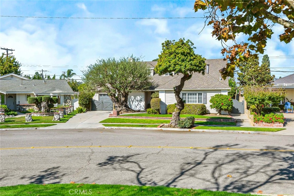 5331 Cerulean Avenue Garden Grove, CA 92845 - Photo 41 of 44 a front view of a house with a yard and table and chairs