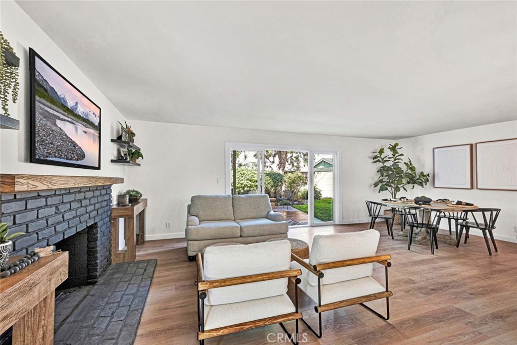 5331 Cerulean Avenue Garden Grove, CA 92845 - Photo 9 of 44 a living room with furniture a fireplace and a table