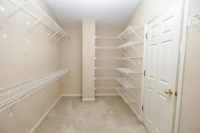 a view of an empty walk in closet