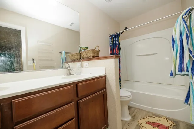 a bathroom with a sink a toilet and a bathtub
