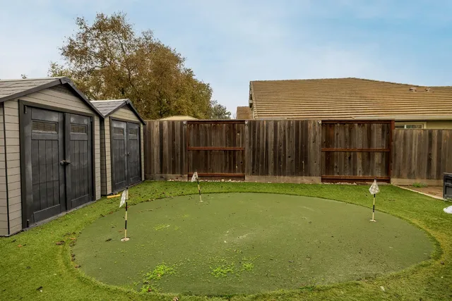 a view of swimming pool with a backyard