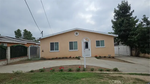 a house view with a backyard space